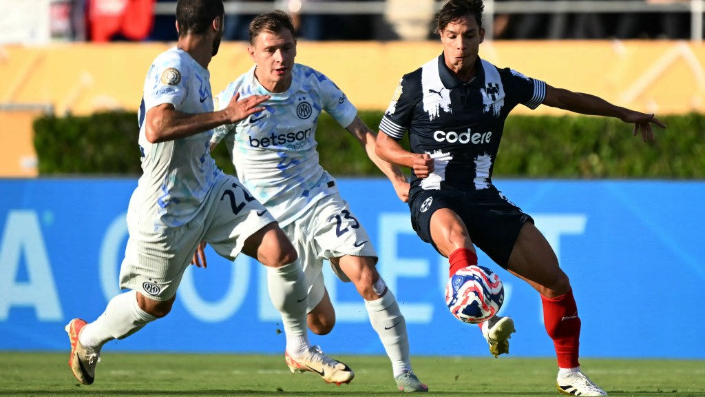 Nicola Barella and Henrik Mkhitaryan chase a Monterrey player in their Club World Cup match for Inter