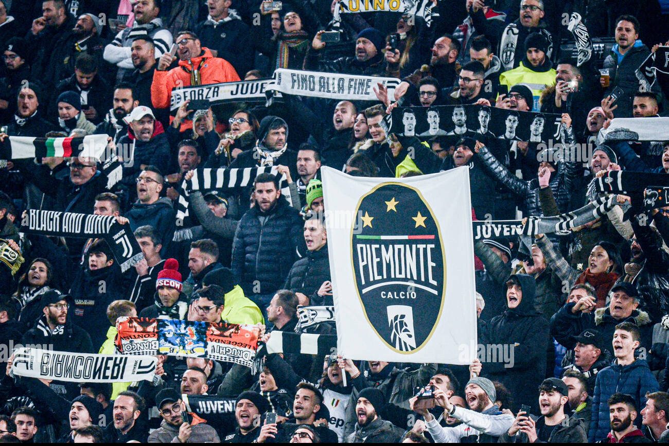 Juventus fans wave Piemonte Calcio flags at their matches
